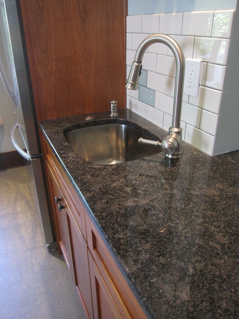 A secondary prep sink will improve the kitchen functionality, particularly for a larger family.